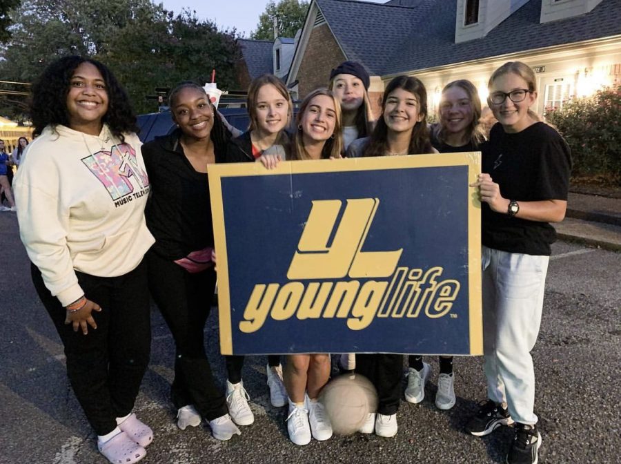  Posing with the Young Life logo, students stand outside the Young Life house. The group got together for their first meeting of the 2022 to 2023 school year. 
