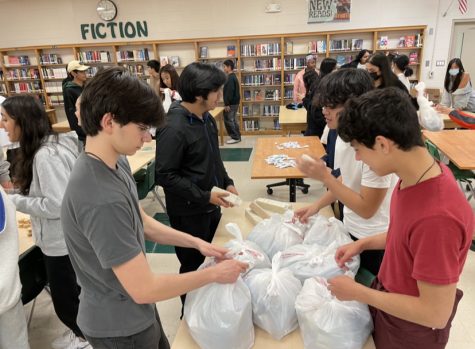 Students finish making care packages with hygiene products, clothing and food to prepare for the care package event at Calvary Episcopal. These packages were distributed on Feb. 19 by 30 White Station High School students.