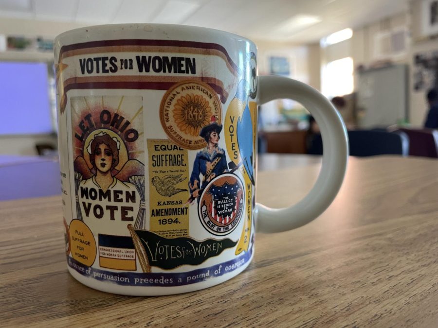 +U.S.+History%2C+AP+Seminar+and+AP+Research+teacher+Montana+Young+has+many+trinkets+representing+women%E2%80%99s+rights+and+suffrage%2C+including+a+coffee+mug.+A+previous+student+of+Young%E2%80%99s+gifted+her+the+mug.%0A