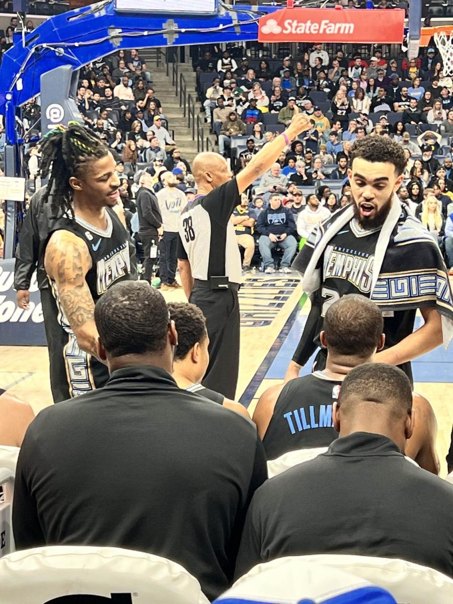 Ja Morant and Dillon Brooks talk to players on the bench before playing against the Houston Rockets. The Grizzlies won the second time in a row against the Rockets in a blowout 151-114.