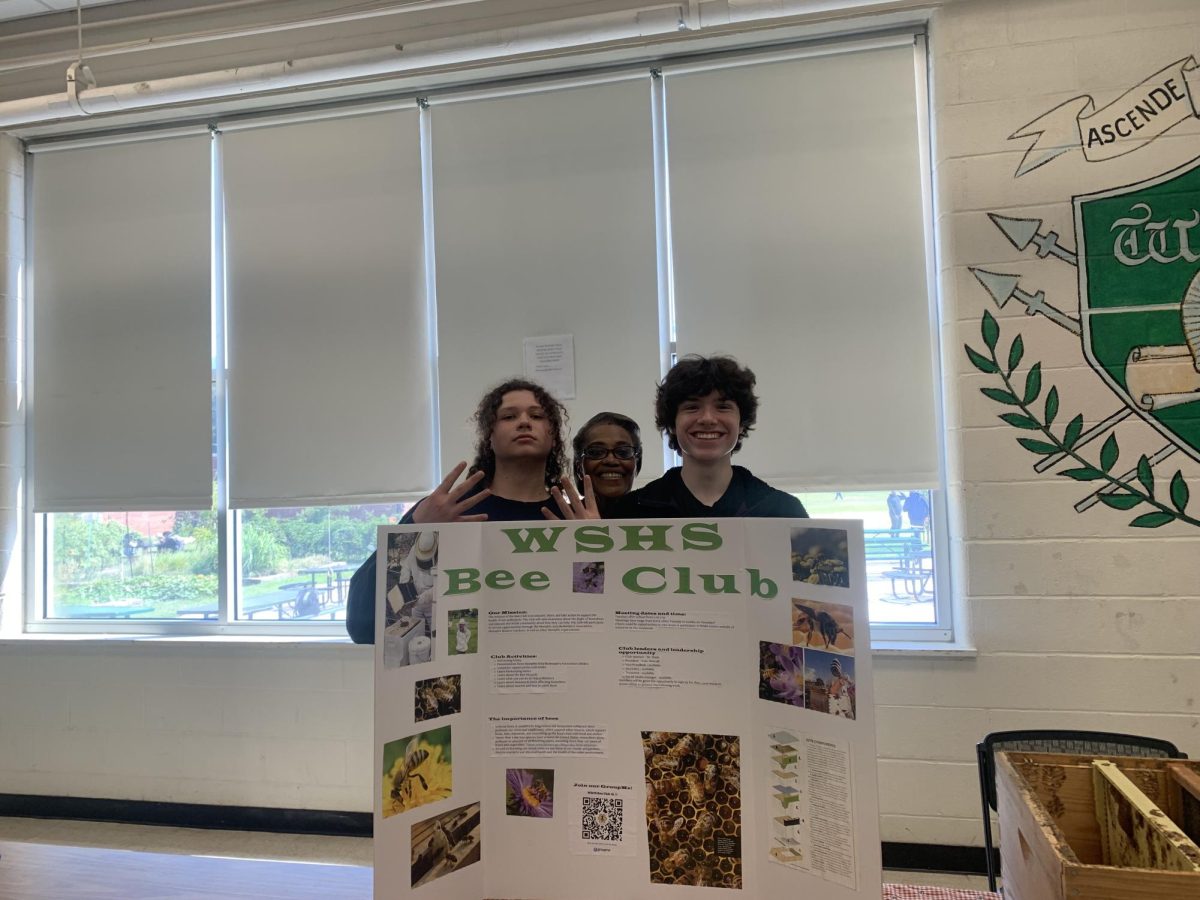 Bee club members pose with their club’s poster during the club fair September 21. Due to the new policy, Bee Club and other clubs have only been meeting on Tuesdays and Thursdays.