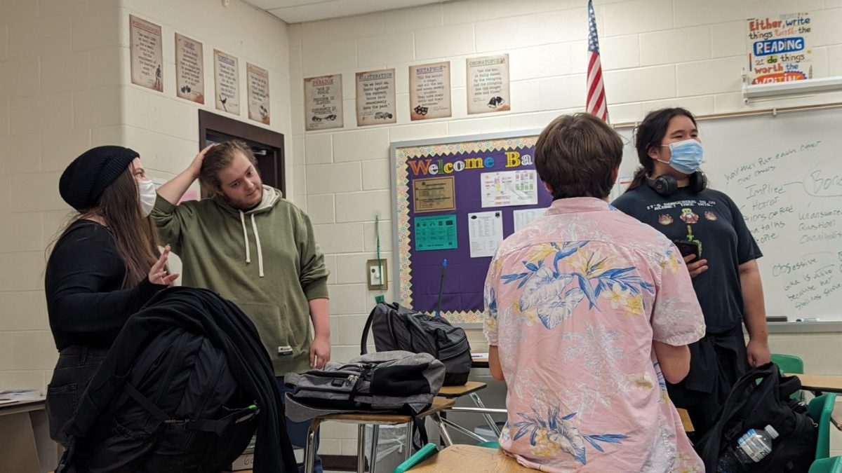 Four dungeon masters gather prior to the Dungeons and Dragons Club’s biweekly meeting. Dungeon masters are able to collaborate and share ideas that they can later implement within their own stories. 