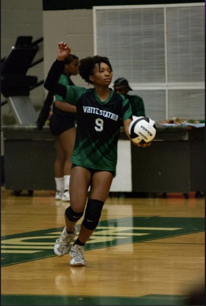Alaya Rhodes (12) serves the ball to the other team: She has been playing volleyball since she was six years old.