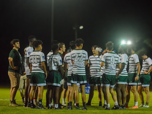 The Spartan rugby team huddles up for half-time. The team was playing against Christian Brothers High.