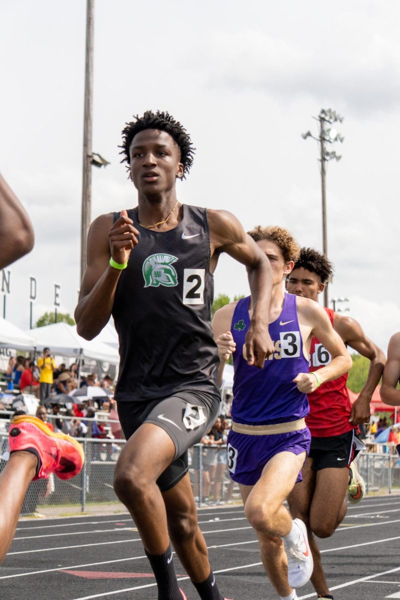 Jarryn Lowe (12) runs the 800 meter race for a boys’ track and field meet held by Houston High School in April 2023. Just a week after this meet, he got an offer from the University of Tennessee at Knoxville’s athletic program.
