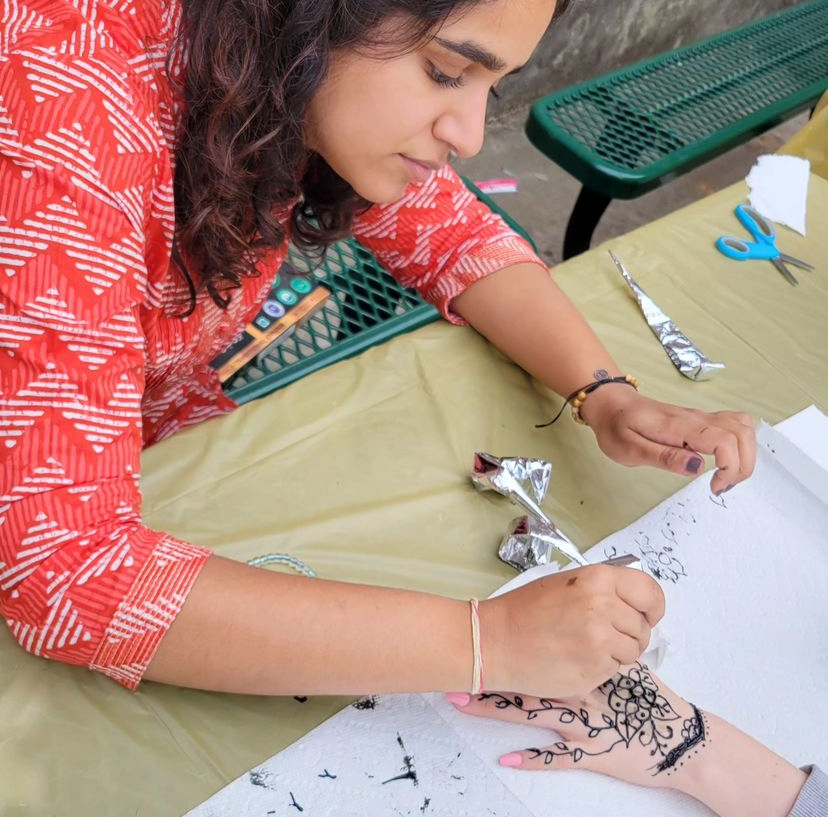 Ira Sharma, the Co-President of the Strive Together Club, draws henna during White Station’s Diwali celebration. Diwali is a festival of lights that celebrates the triumph of light over darkness and is celebrated by over one billion people. 