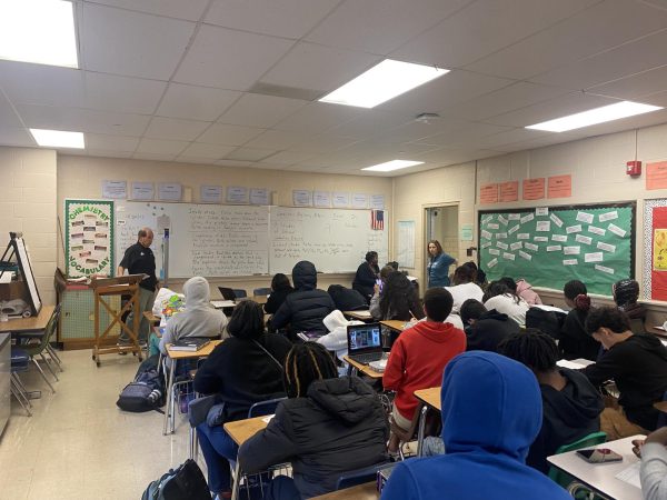 Coach McDonald observes his students complete their work for his Physical Science class. Physical Science is a class offered by the school and is taught to freshmen.