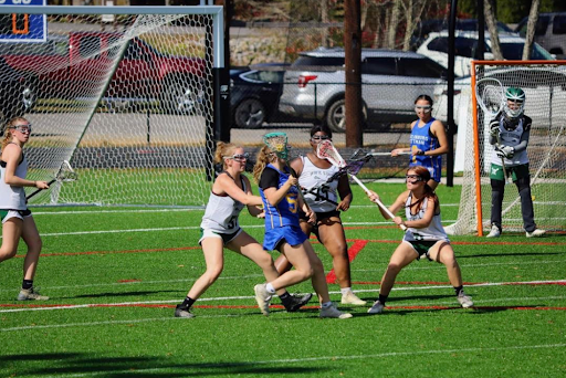 From left to right, Abby Griffith (10), Azaria Jones (10), and Kailyn Card (10) play defense at their second match in the sixth Annual Battle in Gatlinburg . The match resulted in a victory for the Spartans.