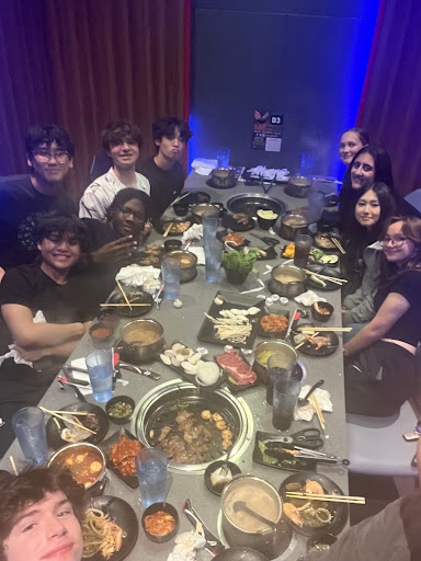 Jeff Blumberg(11) gathers around with close friends to enjoy the hot pot experience. They share this meal during a cool summer night.
