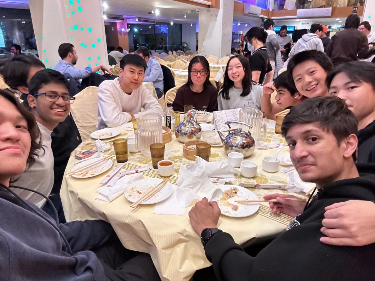 The math team eats dinner on their last night in Boston. The math team visited China Town in Boston while traveling for the Harvard MIT Math Tournament (HMMT)