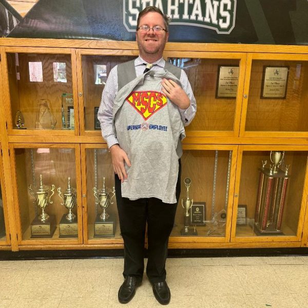  Christopher Robbins poses after receiving the district’s Instructional Teacher Superhero Distinction for the month of November. He has been working in high school education for 20 years.