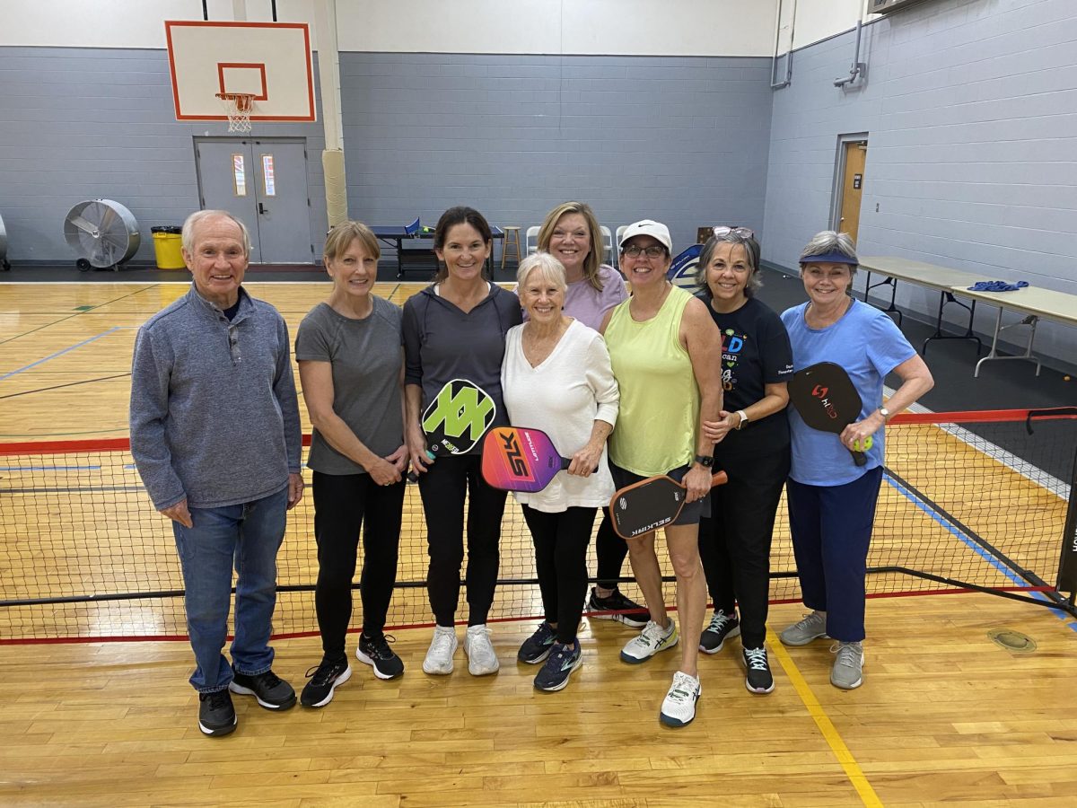 Cristy Pursley and her pickleball friends pose for a picture after their rounds of play. The group meets once or twice a week to play the sport.