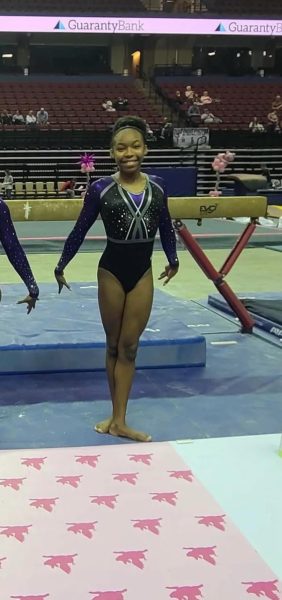  Angel Jackson (11) poses after a gymnastics meet. She is a level eight gymnast and has been playing gymnastics since she was eleven years old.