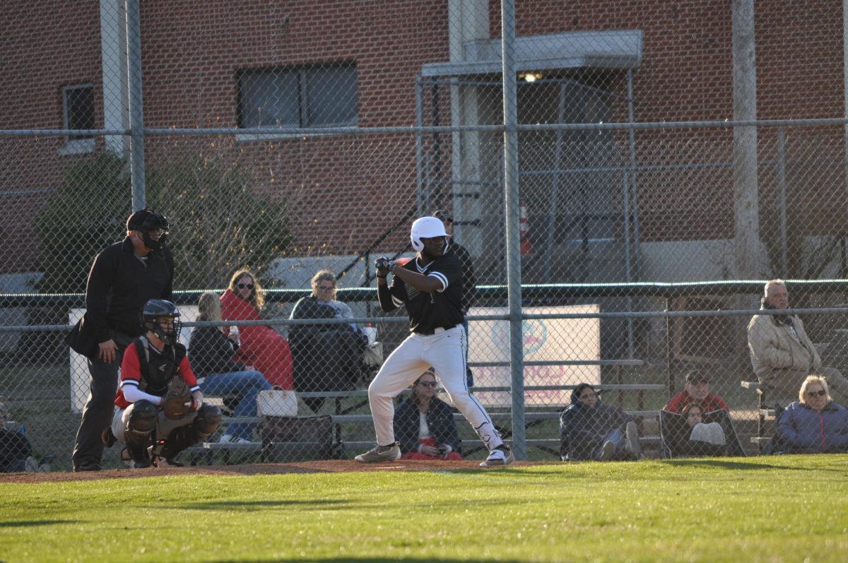 Torrin Thornton (12) at bat against SBA. Thornton combines his physicality from football and the technical skills from baseball to improve his game. 