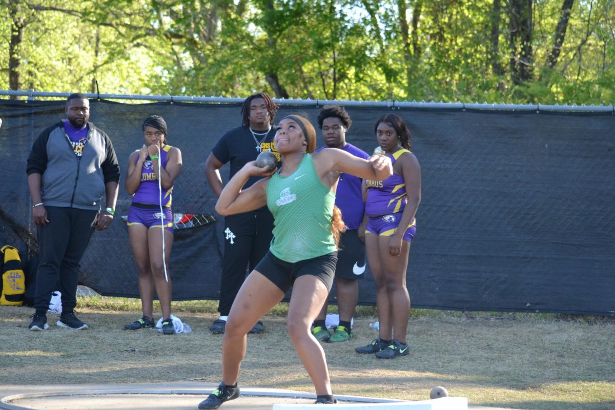 Ci’Anna Gales (12) throws the shot put during a meet at Houston High School. She currently holds White Station’s record for the discus. 