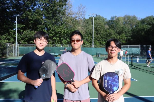 (From left to right) Allen Guo (12), Kayden Li (12) and Joseph Lei (12)  gather together to play pickleball at Cameron Brown park on a Saturday. The three have played  together since March, and it has been one of their favorite hobbies.