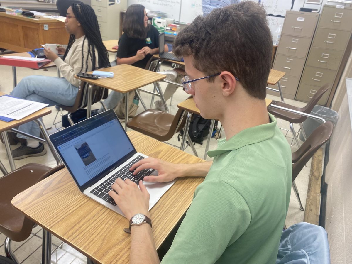 Evan Easley, Co-News and Features team leader for The Scroll, works on his upcoming article. The Scroll has four sections: News and Features, Arts and Entertainment, Viewpoint and Sports — all are used to create a publication by the students, about the students and for the students of WSHS.