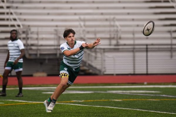 Sammy Kheril (12) catches an important throw in order to move forward. Kheril received the ball with intent to help create a winning run.