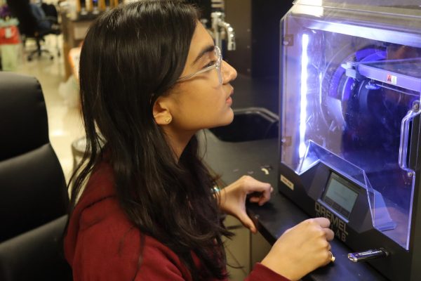 Elina Roy (9) waits on a structure she designed for Science Olympiad to 3D print in the chemistry lab. Roy was on the Science Olympiad team for White Station Middle School and plans to continue it in the high school division.