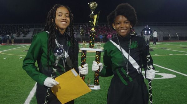 Drum majors Mia Matthews (11) and Xander Martin (12) pose with their first-place trophy. The Spartan Legion won first place in Division AA in the Whitehaven High School Battle of the Bands.