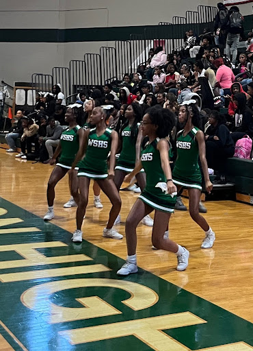 The Spartan basketball cheerleaders keep the basketball teams motivated with their cheers. The team has even created its own cheers specific to White Station High School. 