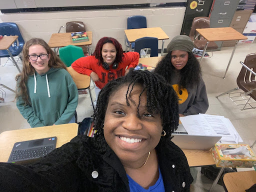 (Front) Faith Gbeneneh (12) takes Advanced Placement (AP) French. (Left to right) Ella Bennett (11), Simone Kester (12) and Taneshia Clear (12) also take AP French; the four of them are taught by N’koumitcha Tassa, making the class size four students.