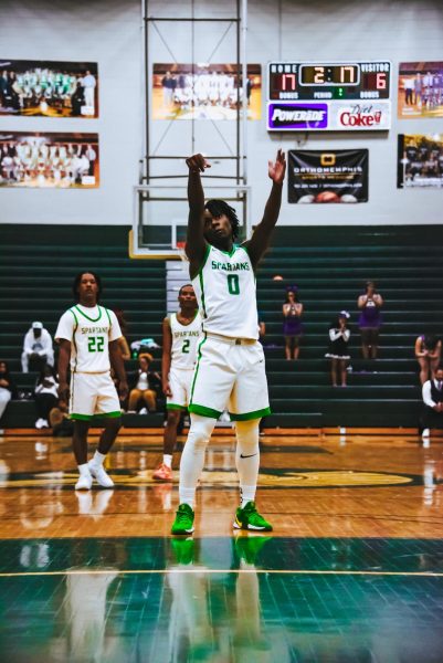  Kobe Bryant shoots a free throw at a game against Central High School. The Spartans won 76-75 that day.
