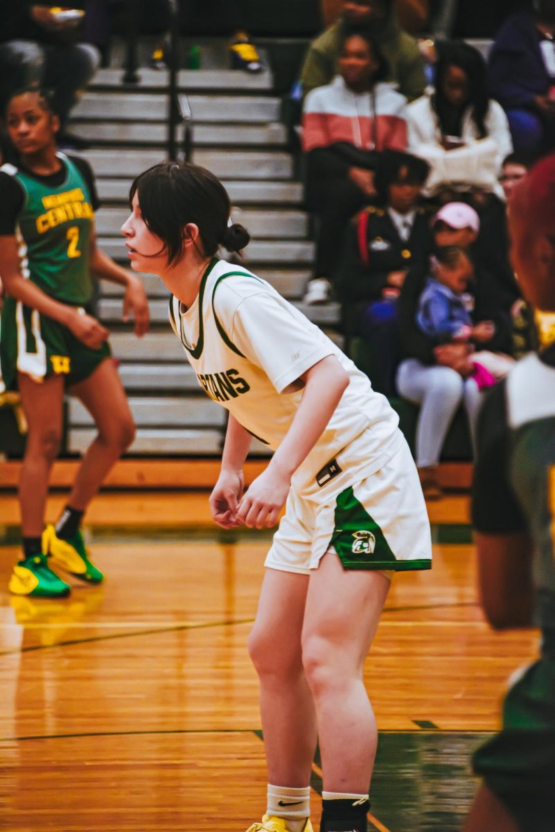 Kikyo Lovin (11) plays in a game against Central High School. Lovin plays the point guard now, but in Japan, she played center.
