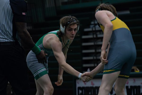 Caleb Lawrence (10) assumes the ready position before a match against a Cordova High School wrestler. Caleb won this match and has wrestled him many times before the City Championships.