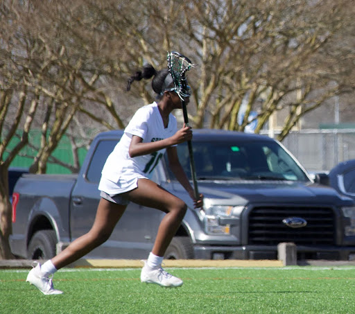 Kennedi Waller (10) charges down the field during a White Station High School lacrosse match. Waller has been on the team since her freshman year.
