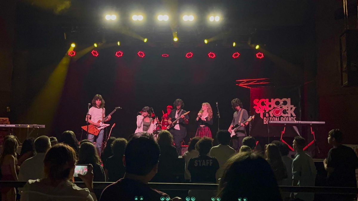  Isis Kalma (10) and her band play at the Houseband senior sendoff, Rooster’s blue house. Kalma is the singer of her band. She makes her own songs and wants to have a music career with her brother.   
