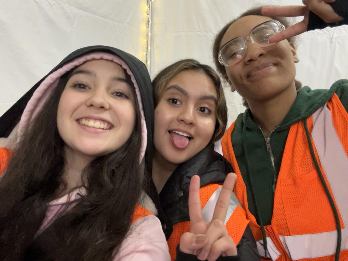 Valery Ferraro (10), Victoria Torres (12) and Jan Williams volunteer for their service project. Their group chose to help with Starry Nights at Shelby Farms Park.