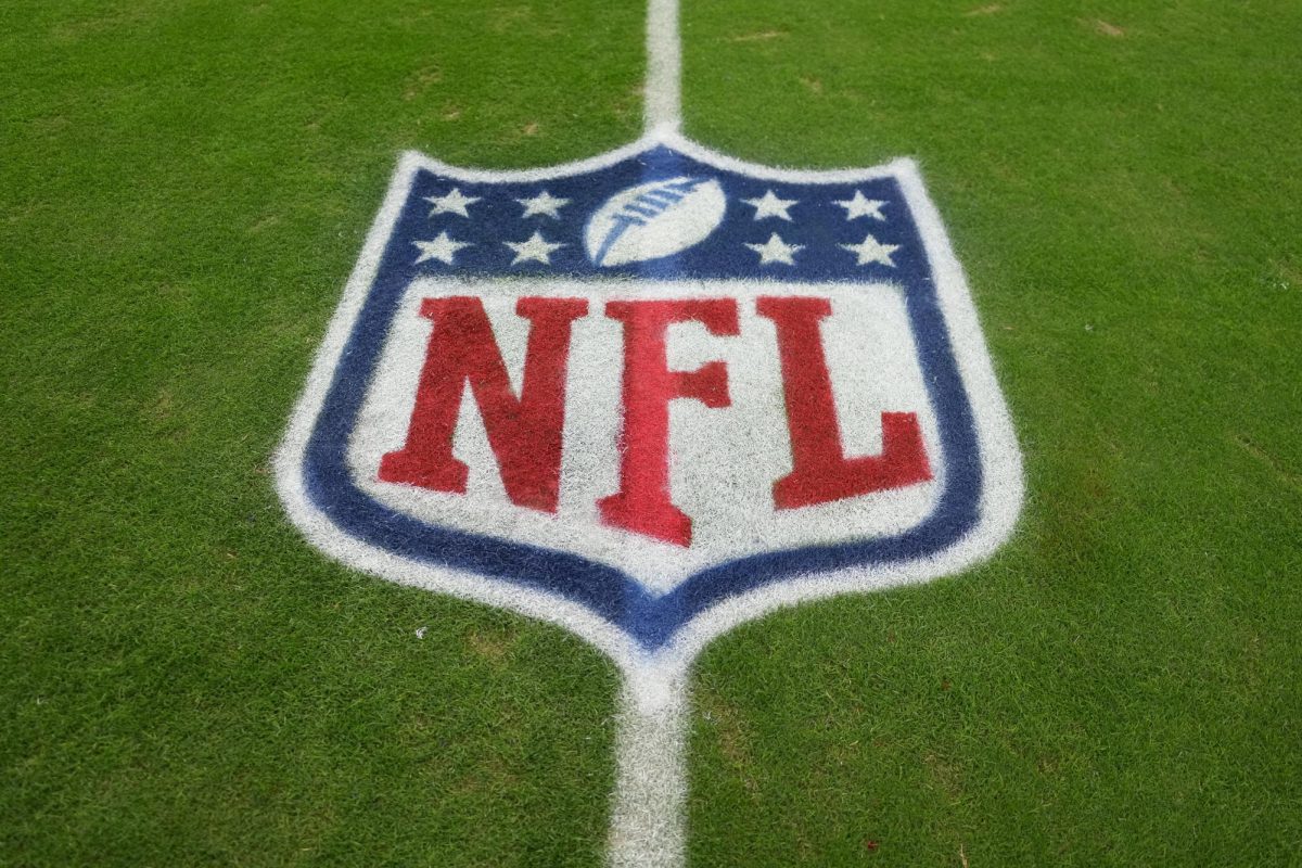  The National Football League (NFL) shield logo sits on the Allegiant Stadium field in Paradise, Nevada ahead of the midpoint of the season in November. At this past NFL game, controversy was felt by many fans due to the choice of Bad Bunny as the halftime show performer. 