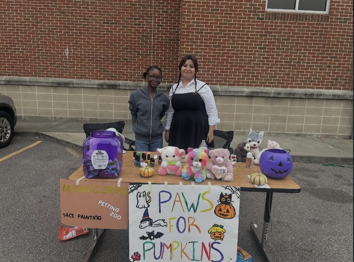 The Humane Society Club participates in the Trunk or Treat. They painted faces with animal designs.