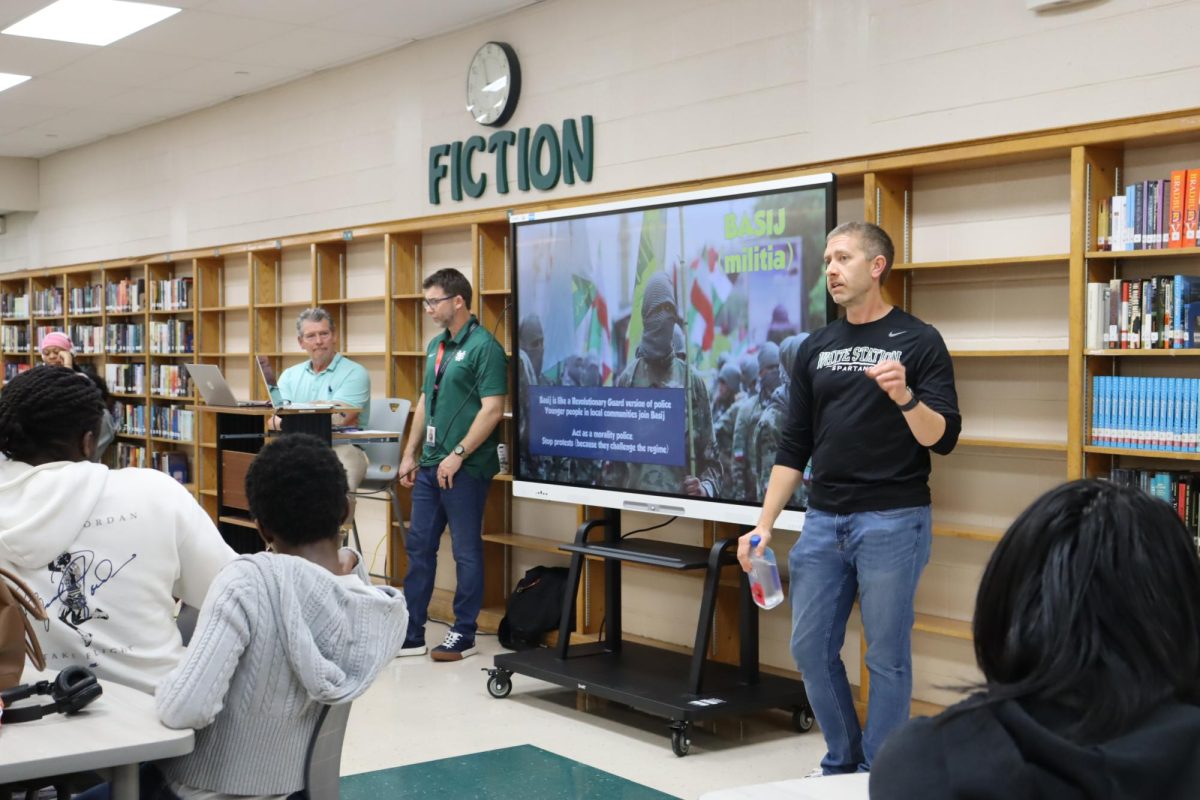 Government and history teachers Mike Stephenson, Kyle Tingley and Curt Rakestraw speak to students at the afterschool Iran War Talk event they organized. A similar Ukraine event was organized by them in 2022 to address student concerns and ensure everyone had an opportunity to learn more about the situation from a credible source. 