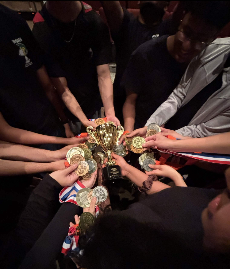 Science Olympiad members display their medals from the state competition. Every member placed well in their events to catapult the team to the national competition. 