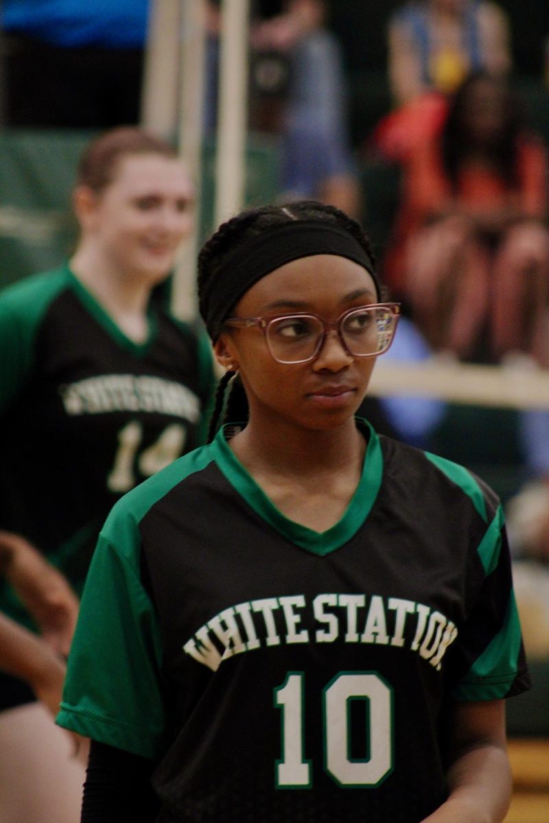 Khloe Woods (11) refocuses between points during her volleyball game. She dealt with a severe ankle injury during the previous season.